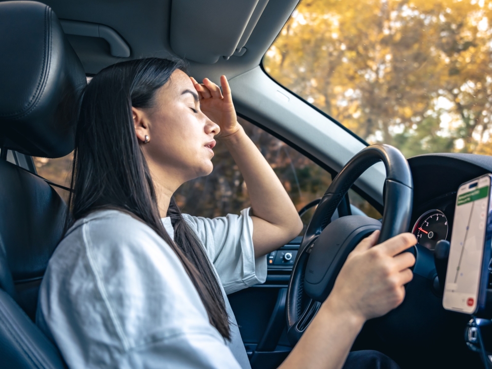 Tired young woman car driver suffering from headache migraine driving vehicle. Tired young woman car driver suffering from headache migraine driving vehicle, unwell exhausted girl feeling sick and stressed inside automobile.